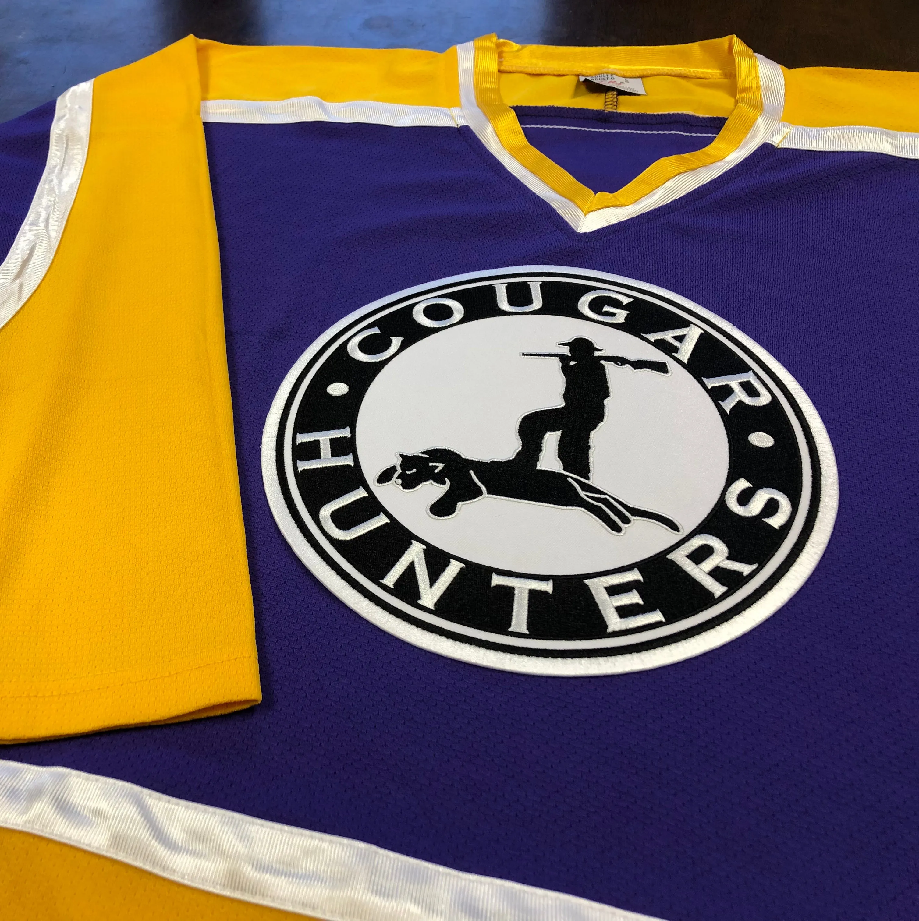 Custom Hockey Jerseys with a Cougar Hunters Embroidered Twill Logo